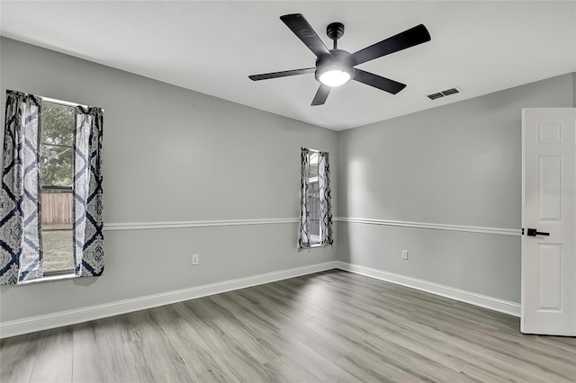 unfurnished room featuring light hardwood / wood-style floors and ceiling fan