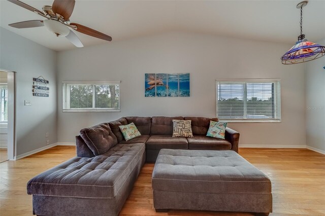 living room featuring vaulted ceiling, ceiling fan, and light hardwood / wood-style floors