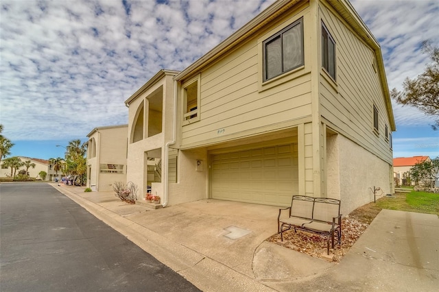 view of home's exterior with a garage