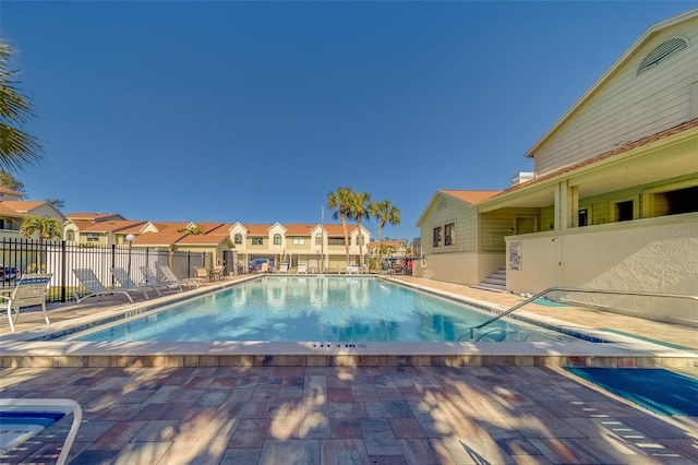 view of swimming pool featuring a patio area