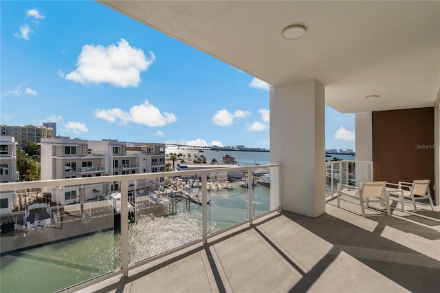 balcony featuring a water view