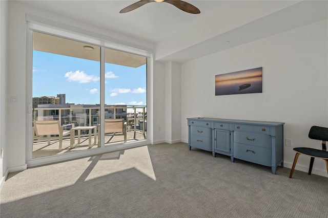 living room with ceiling fan and light carpet