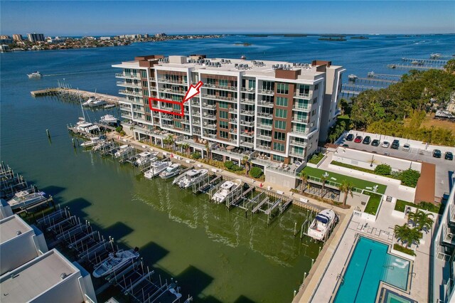 birds eye view of property with a water view