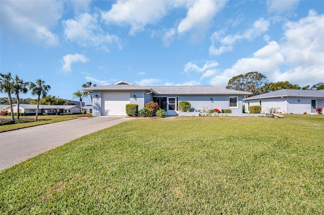 ranch-style house featuring a front yard and a garage