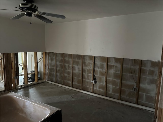 interior space featuring concrete floors and ceiling fan