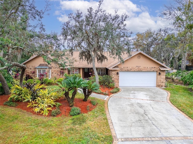 ranch-style house with a garage and a front lawn