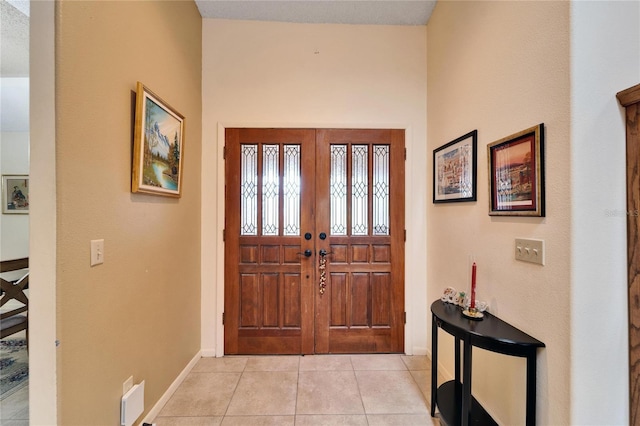 tiled entryway with french doors