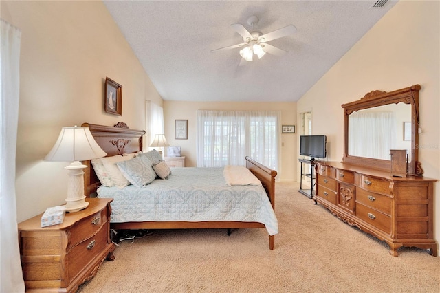 carpeted bedroom with ceiling fan, a textured ceiling, and vaulted ceiling