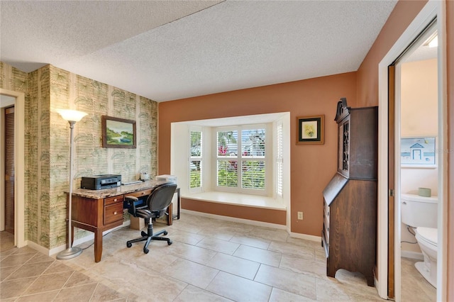 tiled office featuring a textured ceiling