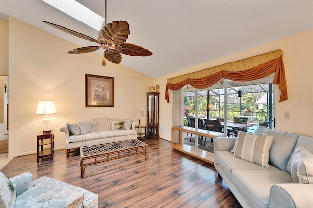 living room with lofted ceiling with skylight, ceiling fan, and hardwood / wood-style flooring