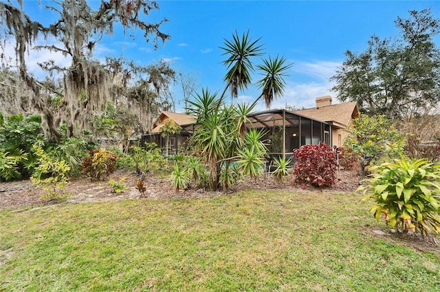 view of yard featuring a lanai