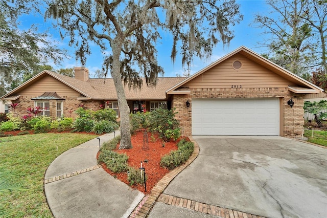 ranch-style house with a garage and a front yard