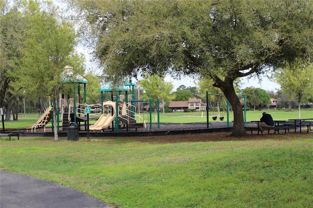 view of jungle gym featuring a lawn