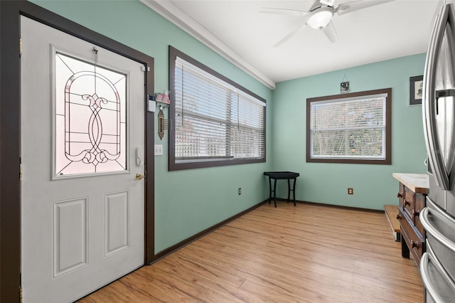 entryway with light wood-type flooring and ceiling fan