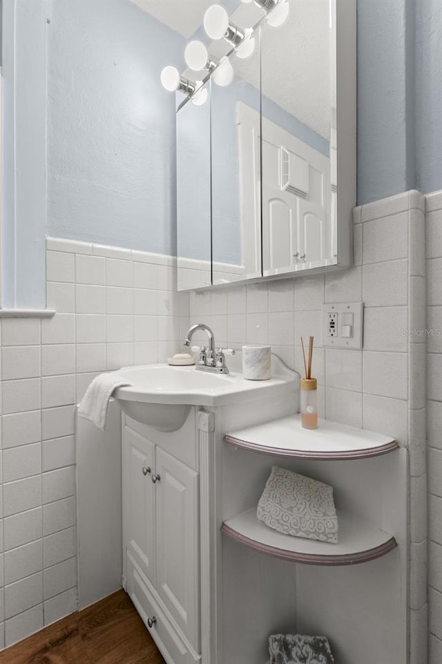 bathroom featuring tile walls and vanity