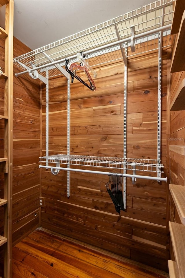 spacious closet featuring hardwood / wood-style floors