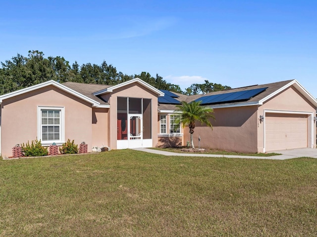 single story home featuring solar panels, a front lawn, and a garage