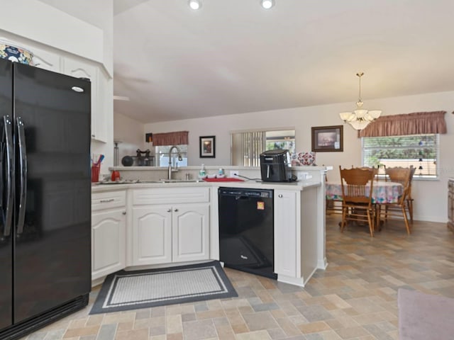 kitchen featuring kitchen peninsula, hanging light fixtures, black appliances, white cabinetry, and sink