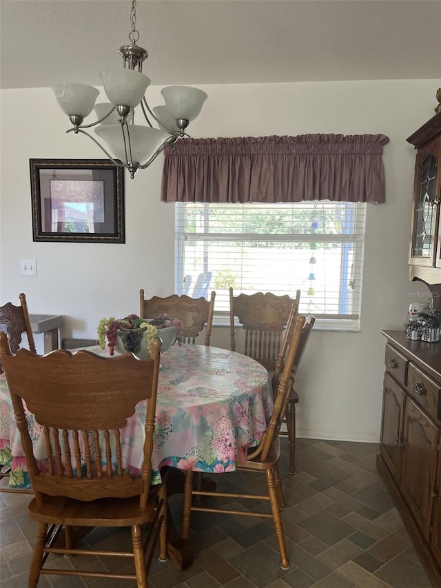 dining space featuring a chandelier