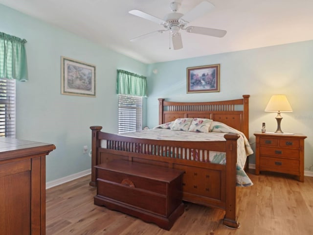 bedroom with ceiling fan and light hardwood / wood-style floors