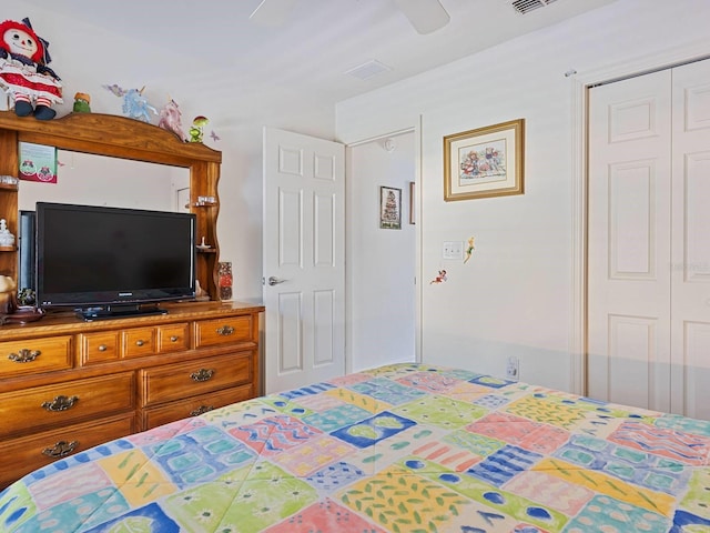 bedroom featuring ceiling fan and a closet