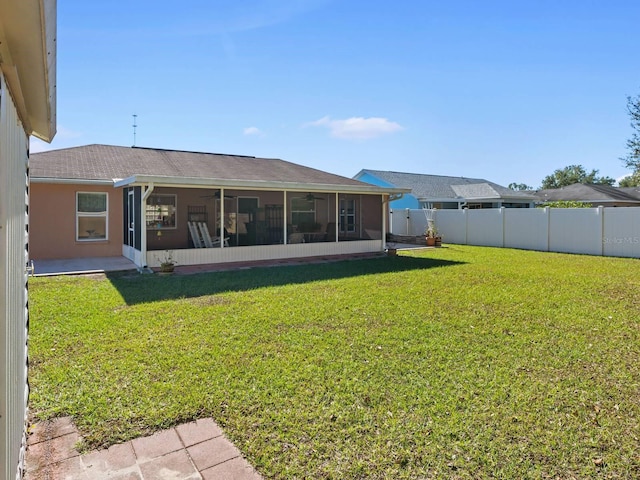 view of yard featuring a sunroom