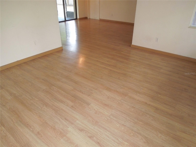 unfurnished room with light hardwood / wood-style floors