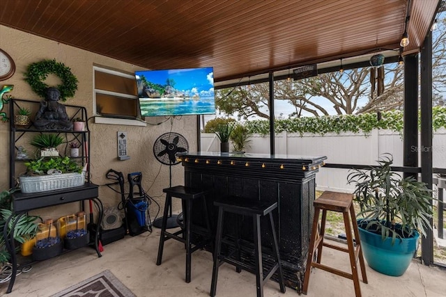 view of patio / terrace featuring an outdoor bar