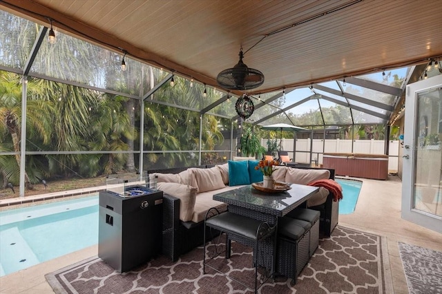 view of patio / terrace with a swimming pool with hot tub, an outdoor hangout area, and glass enclosure