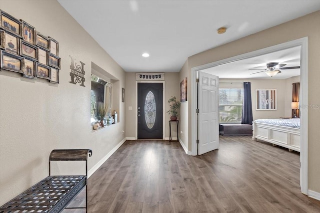 entrance foyer with ceiling fan and hardwood / wood-style floors