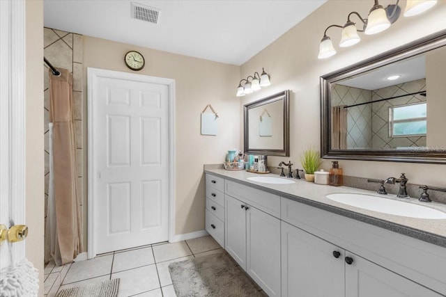 bathroom with vanity, tile patterned floors, and curtained shower