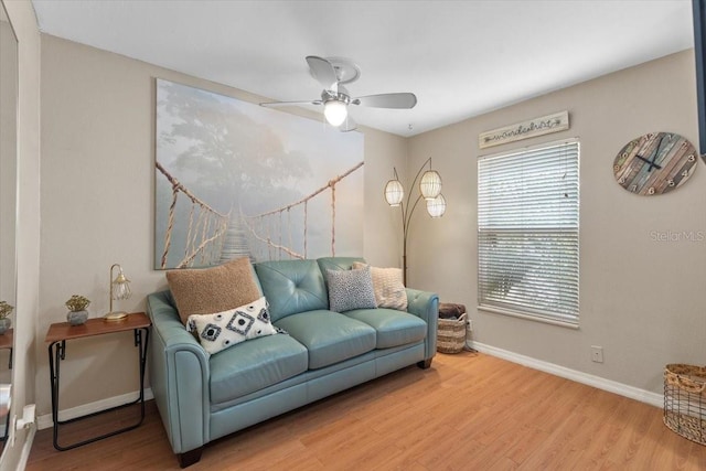 living room with ceiling fan and hardwood / wood-style floors