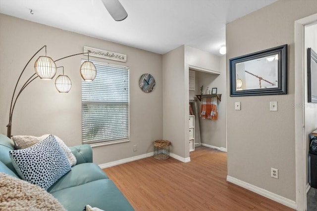 interior space with ceiling fan, a healthy amount of sunlight, and hardwood / wood-style flooring