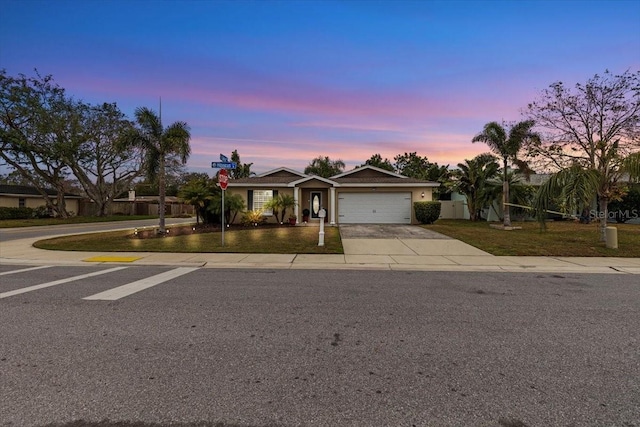 ranch-style home featuring a garage