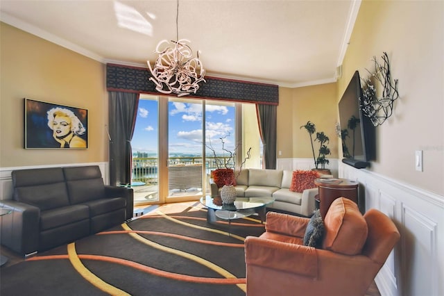 living room featuring a notable chandelier and ornamental molding