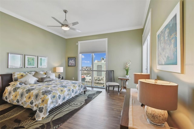 bedroom with access to outside, ceiling fan, dark wood-type flooring, and ornamental molding