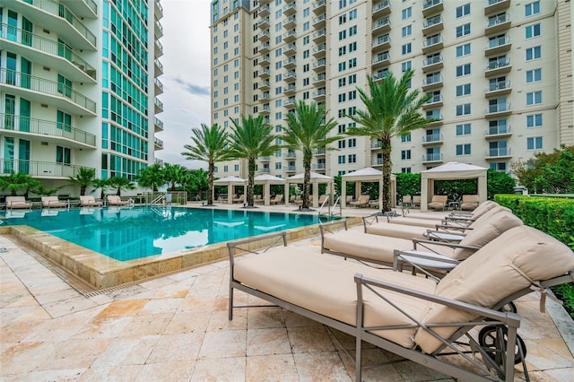 view of pool featuring a gazebo and a patio