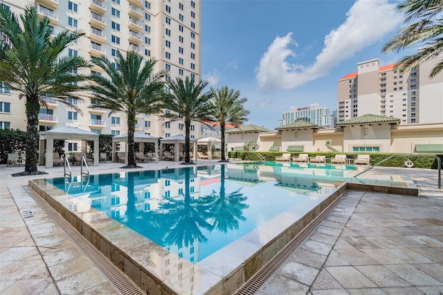 view of swimming pool featuring a patio area