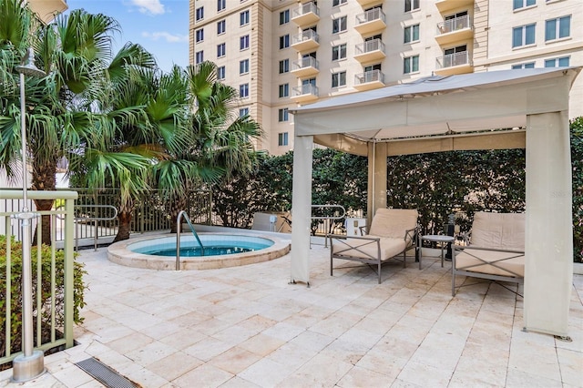 view of patio featuring a gazebo and a hot tub