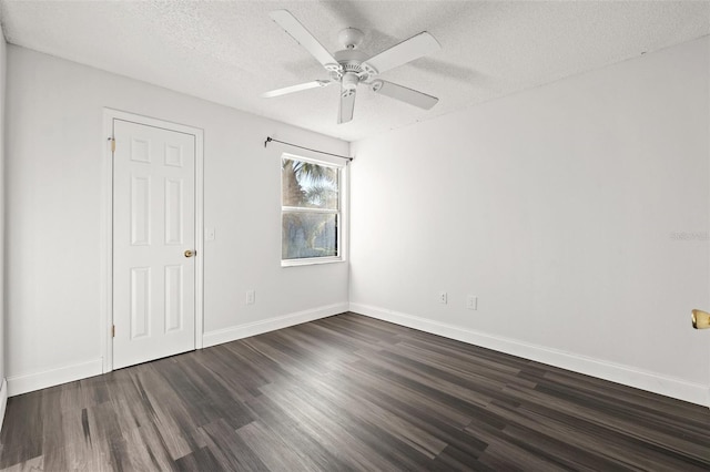 unfurnished room with a textured ceiling, ceiling fan, and dark hardwood / wood-style flooring