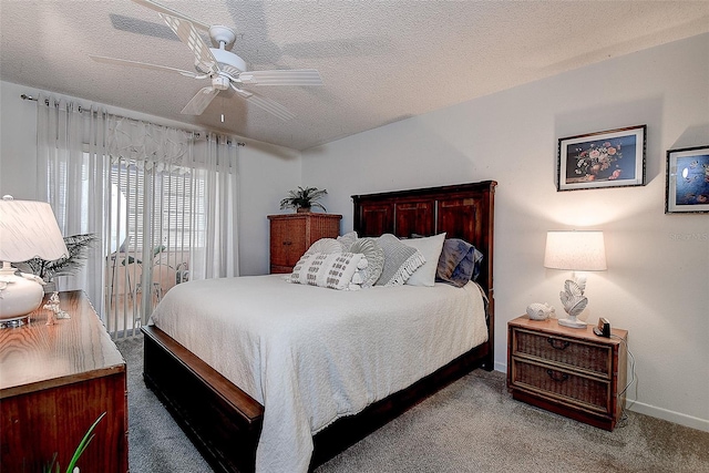 bedroom with a textured ceiling, ceiling fan, and light carpet