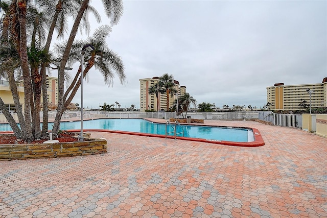 view of swimming pool with a patio area