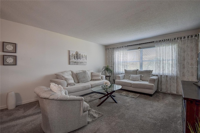 living room with a textured ceiling and dark carpet