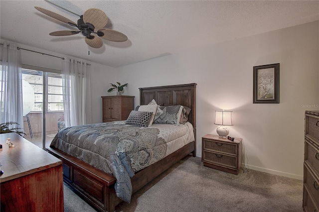 carpeted bedroom with access to exterior, a textured ceiling, and ceiling fan