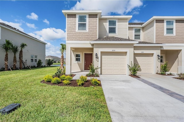 view of front facade featuring a front yard and a garage