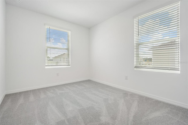 empty room featuring light carpet