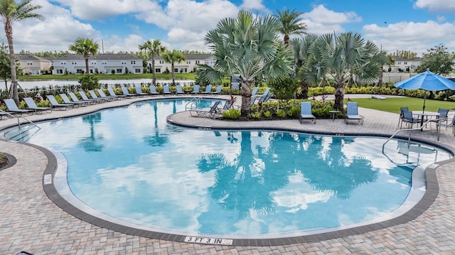 view of swimming pool featuring a patio