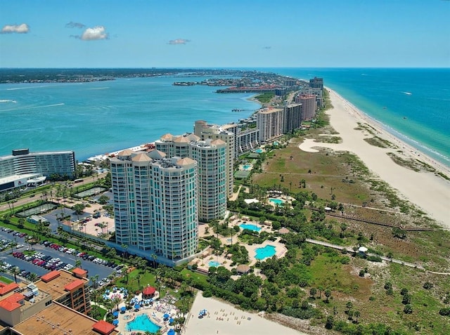 bird's eye view with a water view and a view of the beach