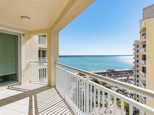 balcony featuring a water view