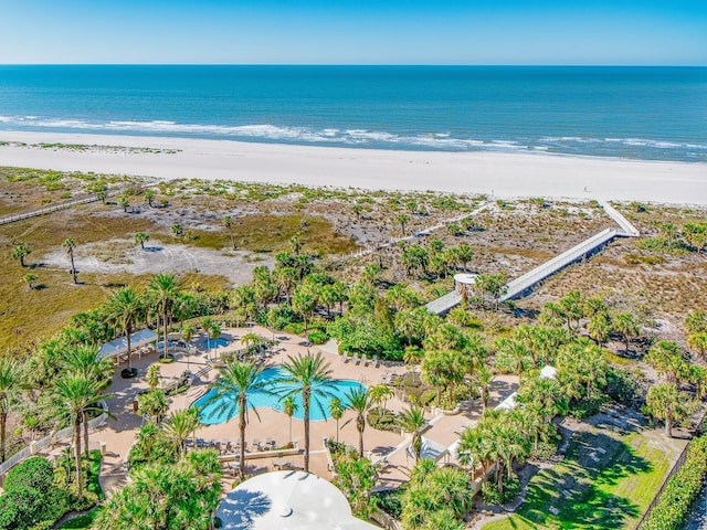 birds eye view of property with a view of the beach and a water view